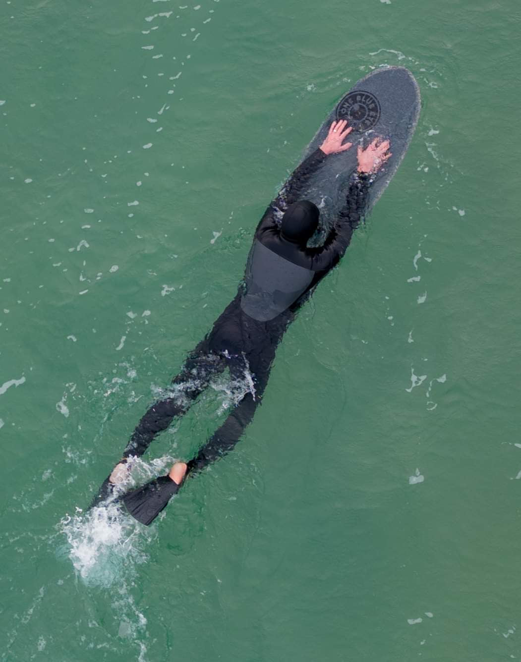 surfer on on recycled plastic bodyboard